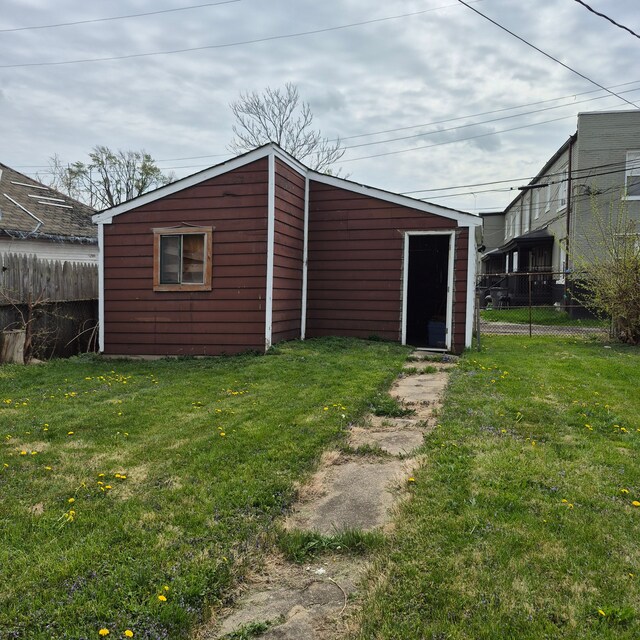 view of outbuilding with fence