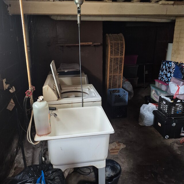 washroom featuring laundry area and a sink