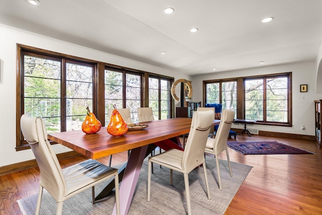 dining room featuring a healthy amount of sunlight, baseboards, and recessed lighting