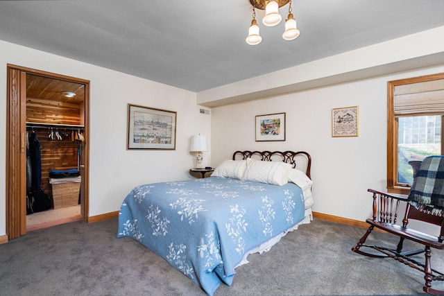 bedroom featuring baseboards, carpet flooring, and visible vents
