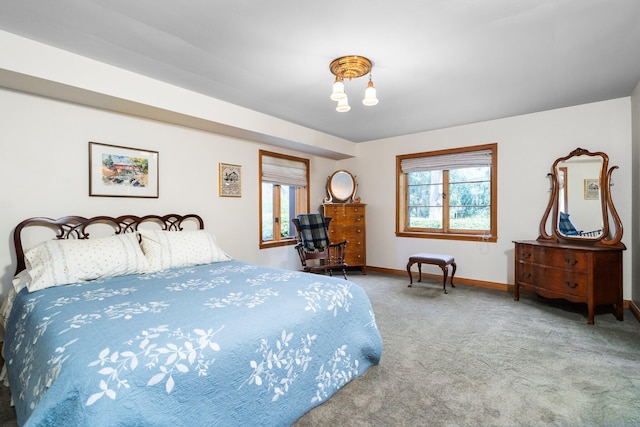 carpeted bedroom with baseboards