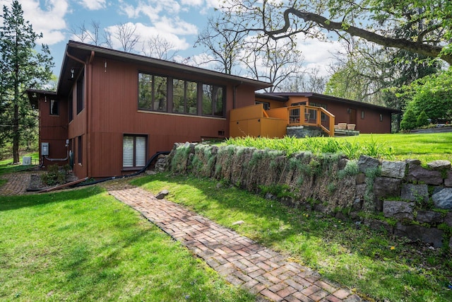 exterior space featuring a yard and a deck
