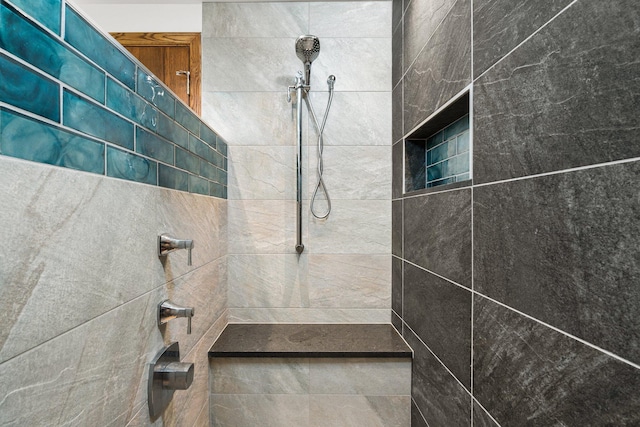 full bath with a tile shower