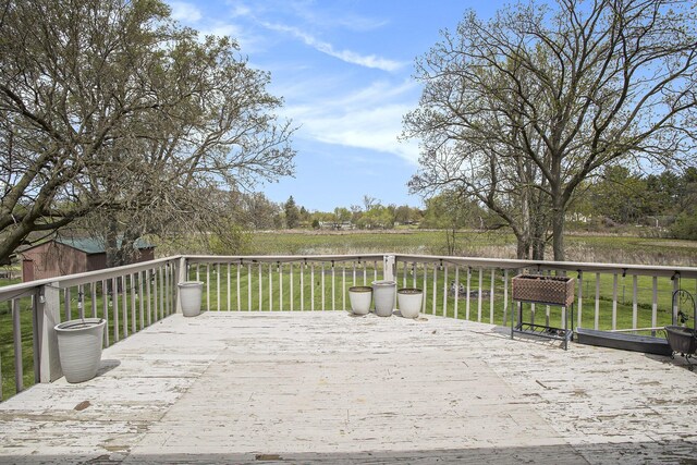 wooden deck with a yard