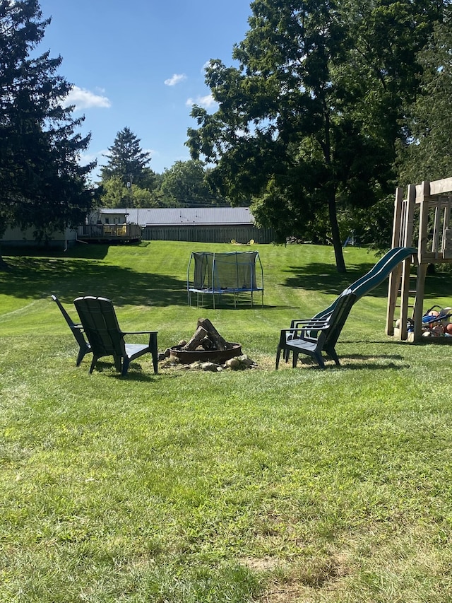 307 N Court St, Stanton, MI 48888 - view of yard featuring a playground and a trampoline