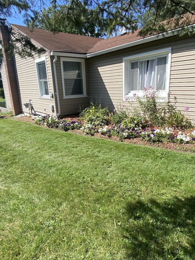 307 N Court St, Stanton, MI 48888 - view of side of property with a yard
