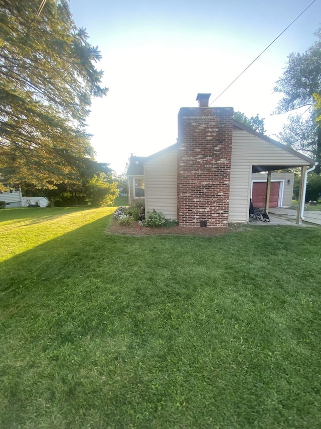 307 N Court St, Stanton, MI 48888 - view of home's exterior featuring a lawn and a chimney