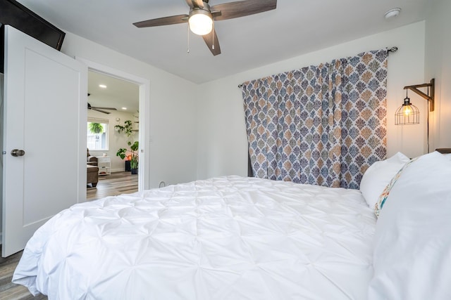 bedroom with recessed lighting, ceiling fan, and wood finished floors