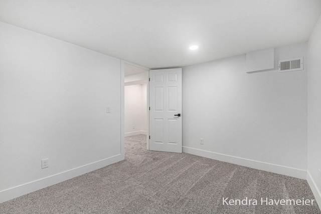 basement featuring carpet floors, recessed lighting, baseboards, and visible vents