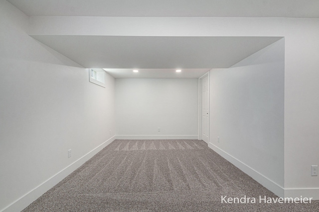 finished basement featuring baseboards, light carpet, recessed lighting, and visible vents