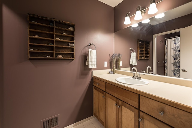 full bathroom with vanity, tile patterned flooring, and visible vents