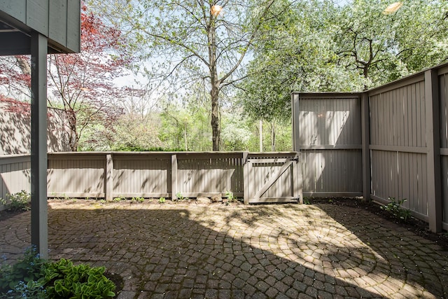 view of patio / terrace with a gate and fence