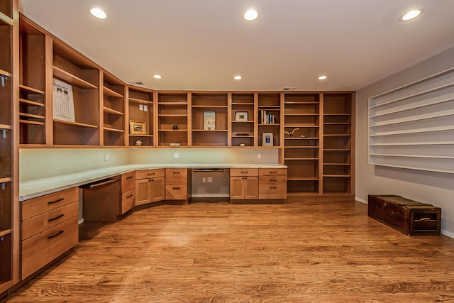 unfurnished office featuring recessed lighting, built in study area, and light wood-style floors