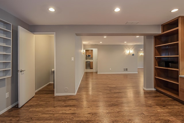interior space with recessed lighting, baseboards, dark wood-style flooring, and visible vents