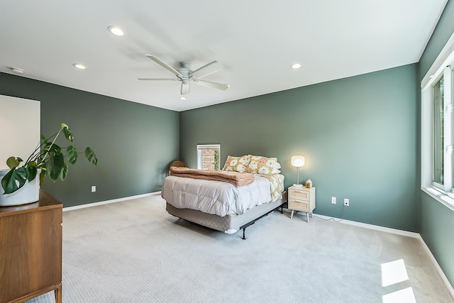 carpeted bedroom featuring baseboards, multiple windows, a ceiling fan, and recessed lighting