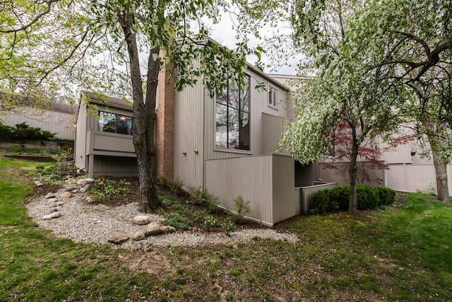 view of side of property featuring a yard