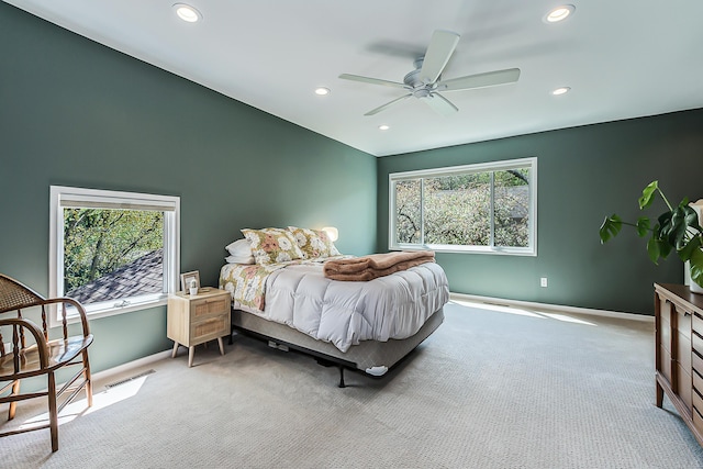 carpeted bedroom featuring baseboards, ceiling fan, recessed lighting, and visible vents