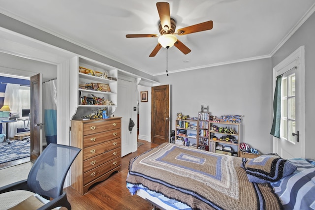 206 S Webster St, Jackson, MI 49203 - bedroom with ornamental molding, ceiling fan, multiple windows, and wood finished floors