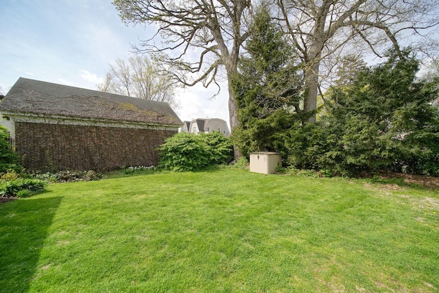 206 S Webster St, Jackson, MI 49203 - view of yard with a storage unit and an outdoor structure
