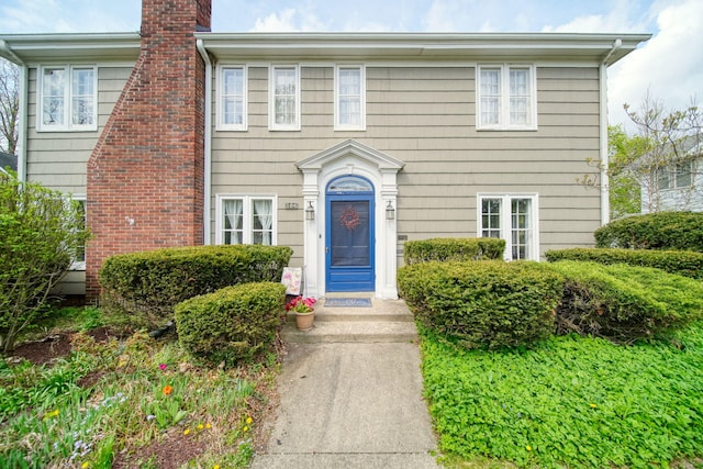 206 S Webster St, Jackson, MI 49203 - view of front facade with a chimney