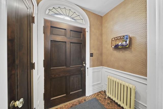 206 S Webster St, Jackson, MI 49203 - property entrance with radiator heating unit