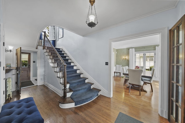 206 S Webster St, Jackson, MI 49203 - interior space featuring baseboards, plenty of natural light, stairs, and wood finished floors