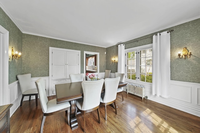 206 S Webster St, Jackson, MI 49203 - dining area featuring crown molding, an inviting chandelier, radiator heating unit, a wainscoted wall, and wallpapered walls