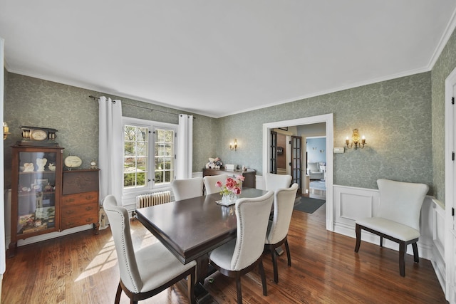206 S Webster St, Jackson, MI 49203 - dining room with french doors, crown molding, wood finished floors, a wainscoted wall, and radiator