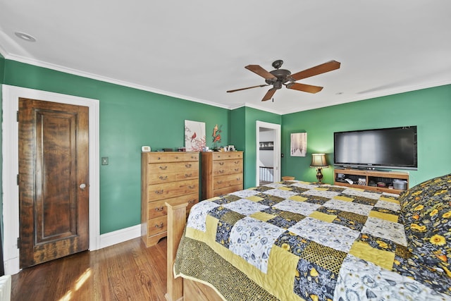 206 S Webster St, Jackson, MI 49203 - bedroom with baseboards, ornamental molding, a ceiling fan, and wood finished floors