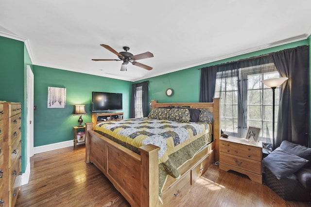 206 S Webster St, Jackson, MI 49203 - bedroom with baseboards, ceiling fan, ornamental molding, and wood finished floors