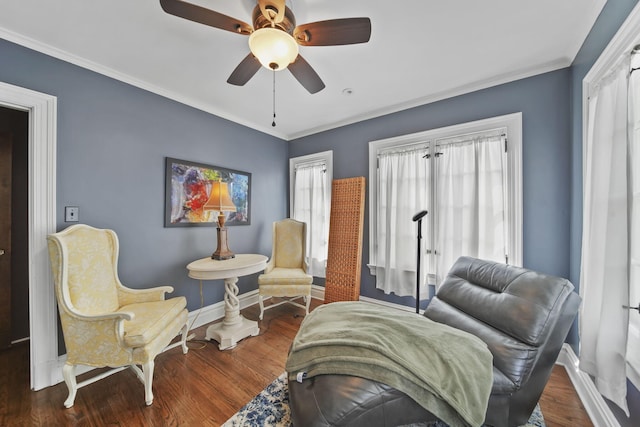 206 S Webster St, Jackson, MI 49203 - living area featuring baseboards, a ceiling fan, wood finished floors, and a wealth of natural light