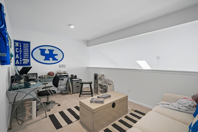 home office with carpet flooring, a skylight, and baseboards