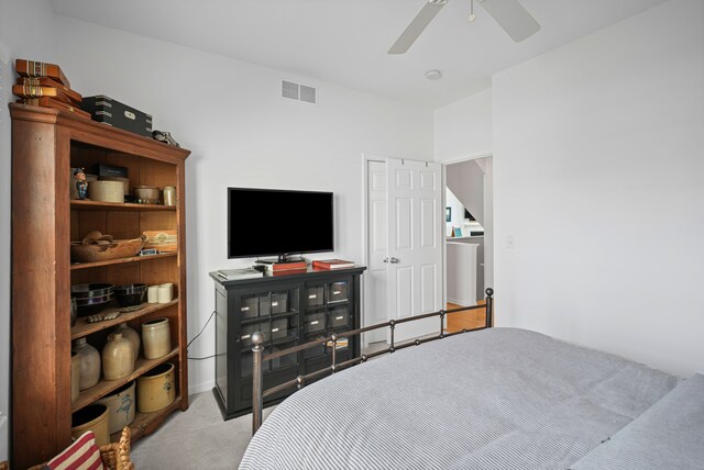 carpeted bedroom featuring visible vents and a ceiling fan