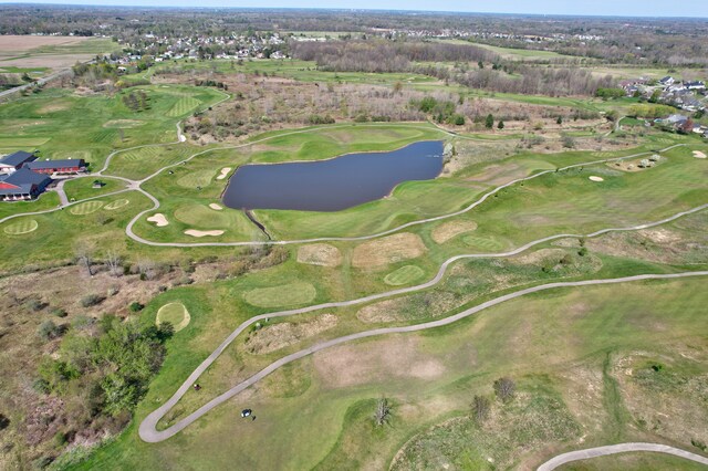 bird's eye view featuring view of golf course and a water view