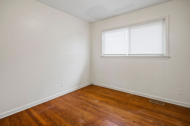 19157 Macarthur, Redford, MI 48240 - spare room featuring baseboards and wood finished floors