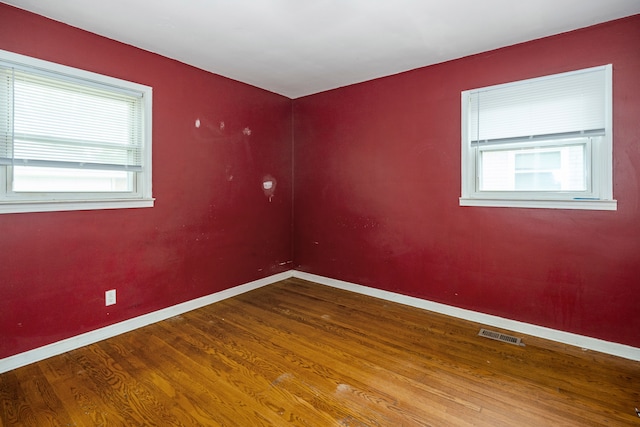 19157 Macarthur, Redford, MI 48240 - empty room with healthy amount of natural light, baseboards, and wood finished floors