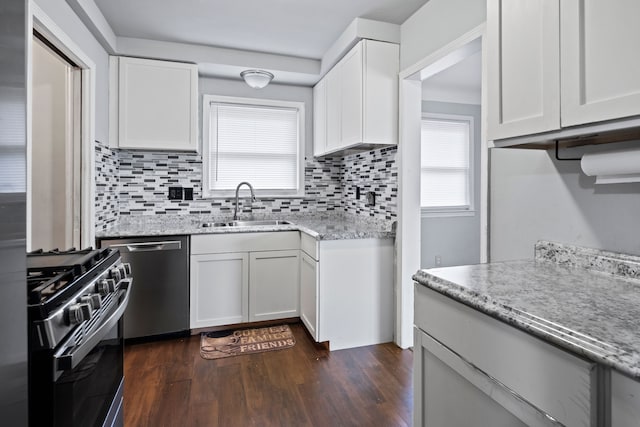 19157 Macarthur, Redford, MI 48240 - kitchen with a sink, dishwasher, range with gas cooktop, decorative backsplash, and dark wood-type flooring