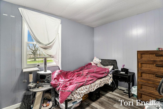 bedroom featuring wood finished floors