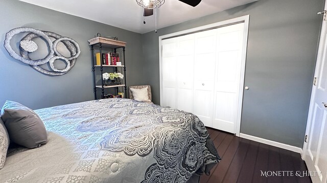 bedroom featuring a closet, baseboards, ceiling fan, and hardwood / wood-style floors