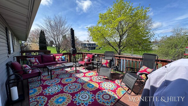 wooden deck with an outdoor hangout area