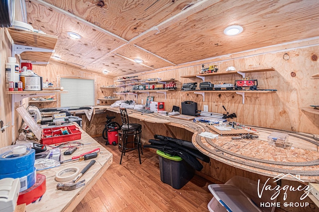 12480 Fargo St NE, Gowen, MI 49326 - interior space featuring wood walls, a workshop area, wood finished floors, and vaulted ceiling