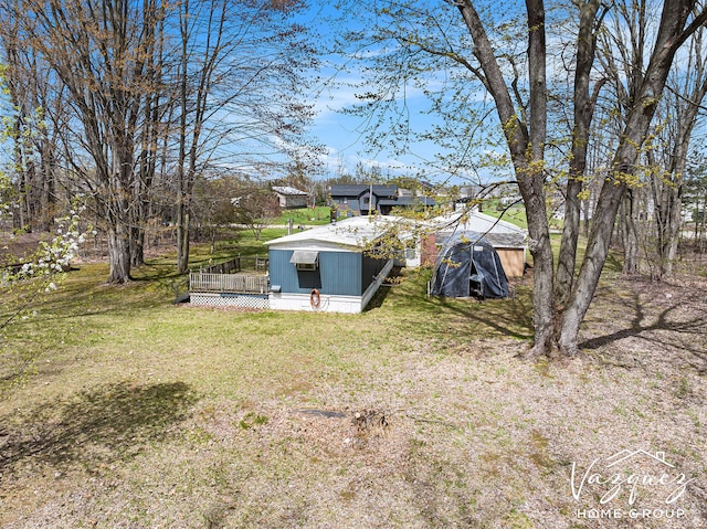 12480 Fargo St NE, Gowen, MI 49326 - view of yard featuring a deck