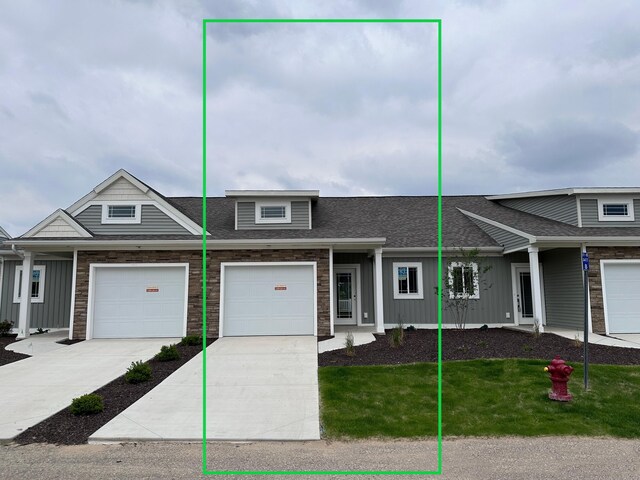 1225 Madera Ct SW, Byron Center, MI 49315 - multi unit property with board and batten siding, roof with shingles, a front lawn, and concrete driveway