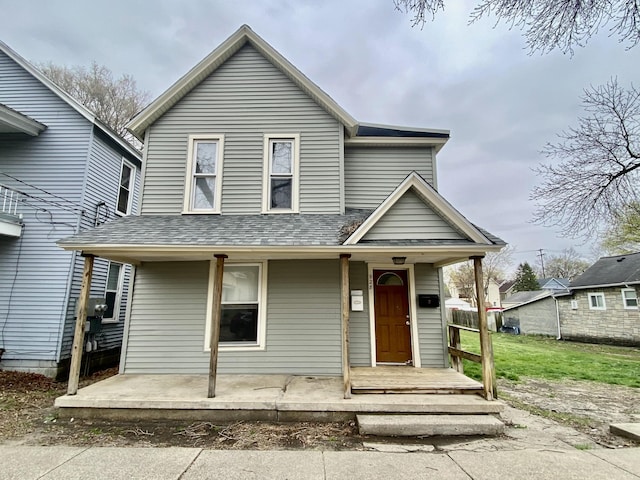 traditional-style house featuring a porch