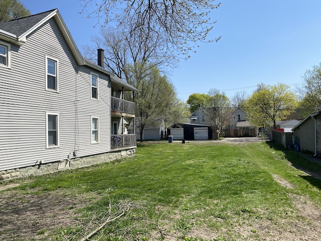 view of yard featuring a balcony