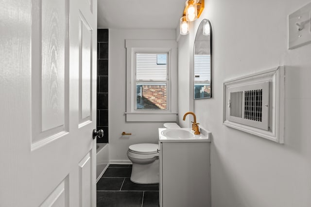 full bathroom featuring shower / tub combination, tile patterned floors, baseboards, vanity, and toilet