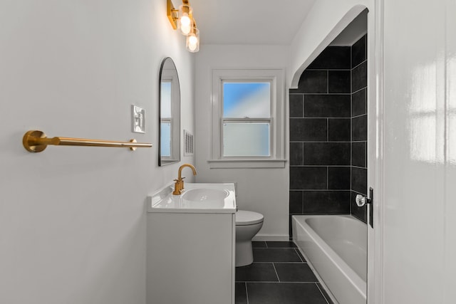 bathroom with tile patterned flooring, vanity, toilet, baseboards, and shower / washtub combination
