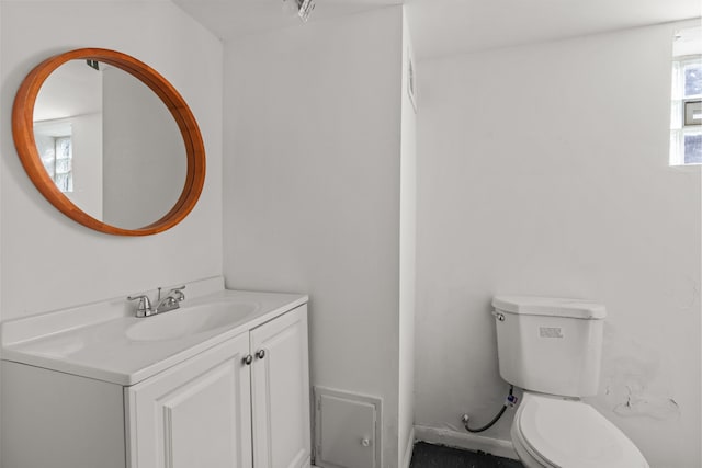 half bath with toilet and vanity