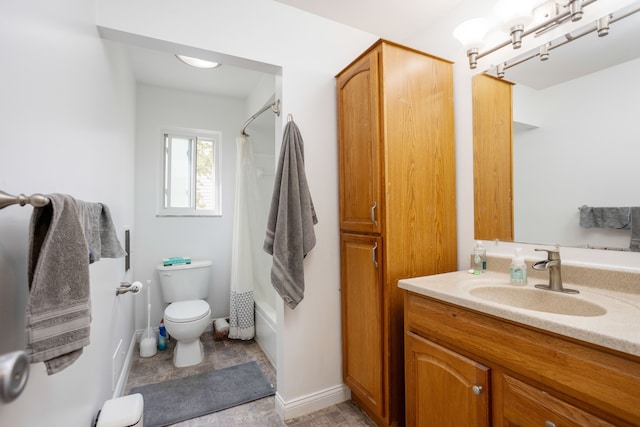 bathroom with vanity, shower / bath combo with shower curtain, and toilet