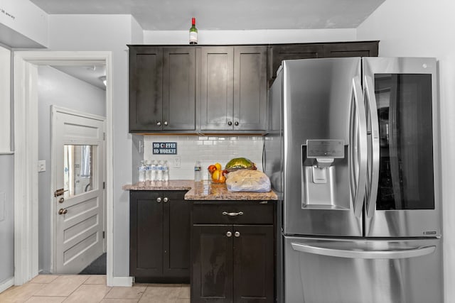 1111 N Franklin St, Dearborn, MI 48128 - kitchen featuring light stone counters, stainless steel fridge, baseboards, light tile patterned floors, and backsplash